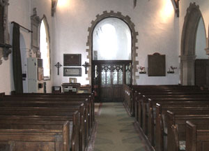 The Nave looking west showing the window to the bell tower installed in 1959